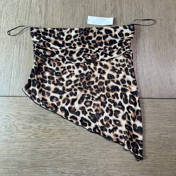 Urban Outfitters Tops - Urban Outfitters Sleeveless Asymmetrical Leopard Print Top Size Large NWT!